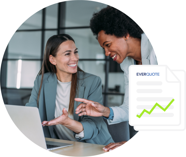 Two smiling insurance agents in front of a laptop with an illustrated EverQuote ebook in foreground.